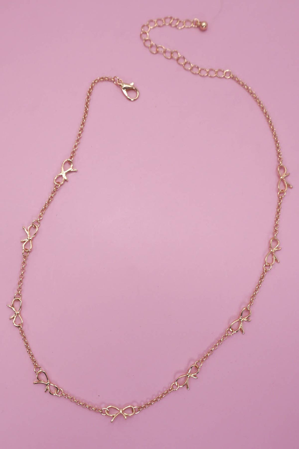CUTOUT BOW STATION NECKLACE | Gold