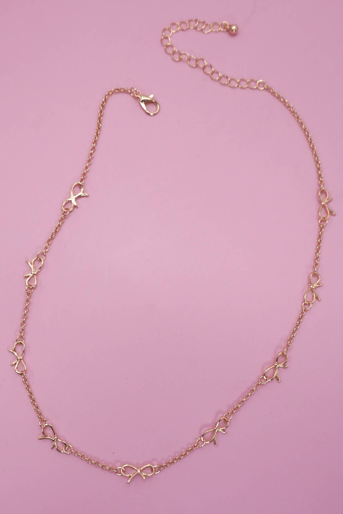 CUTOUT BOW STATION NECKLACE | Gold