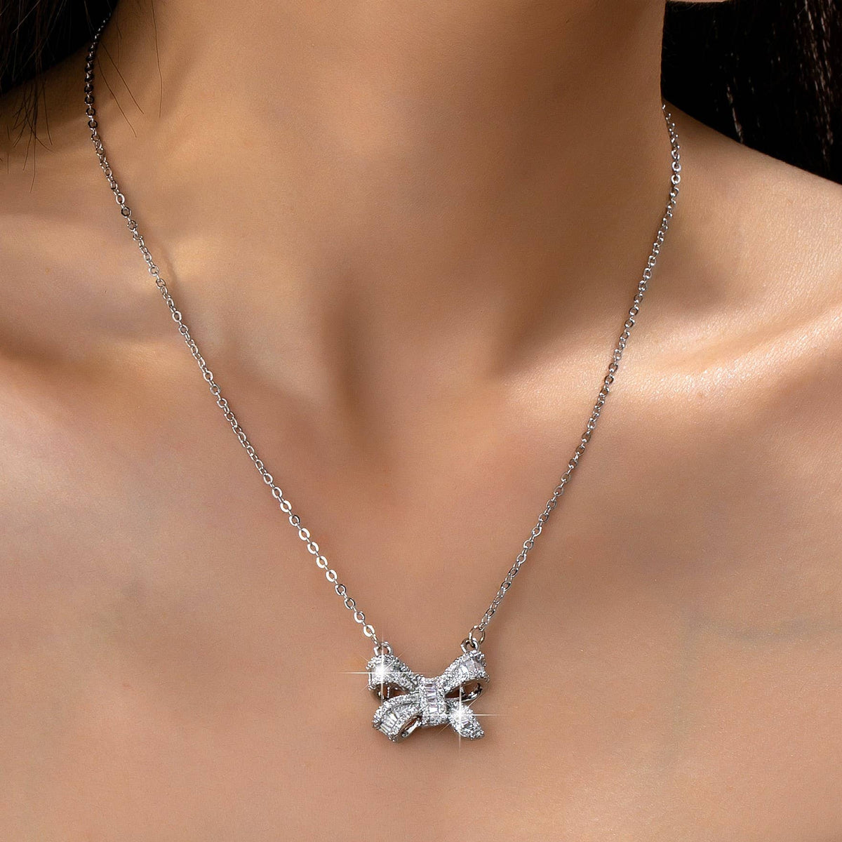 Sparkling Crystal Bow Pendant Necklace: Silver