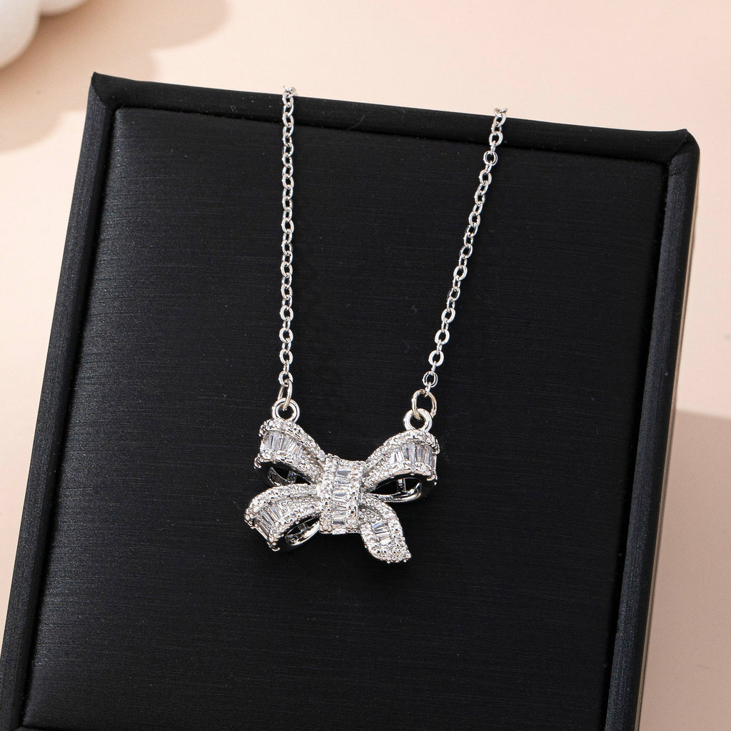 Sparkling Crystal Bow Pendant Necklace: Silver