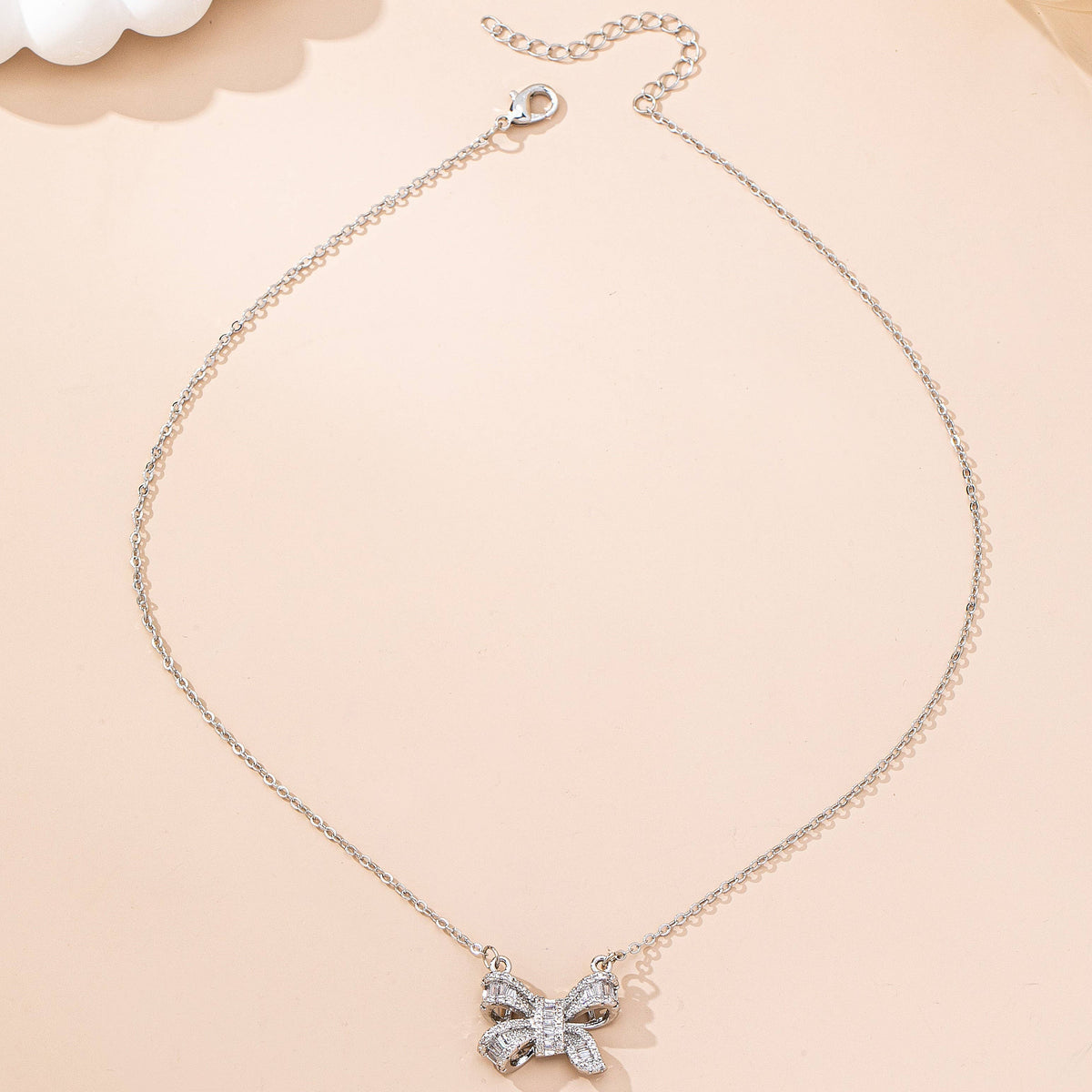Sparkling Crystal Bow Pendant Necklace: Silver