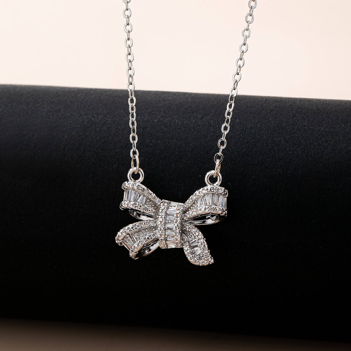 Sparkling Crystal Bow Pendant Necklace: Silver